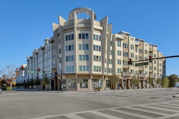 a large building on the corner of a street at an intersection
