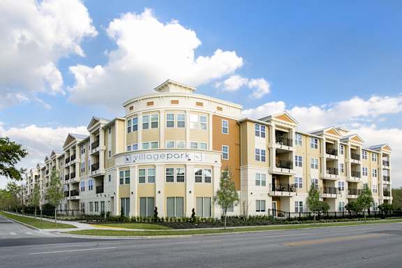 Apartment building with the name "Village Park" on the front.