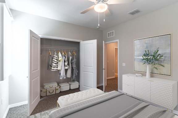 A bedroom with a bed, a wardrobe, and a painting on the wall.