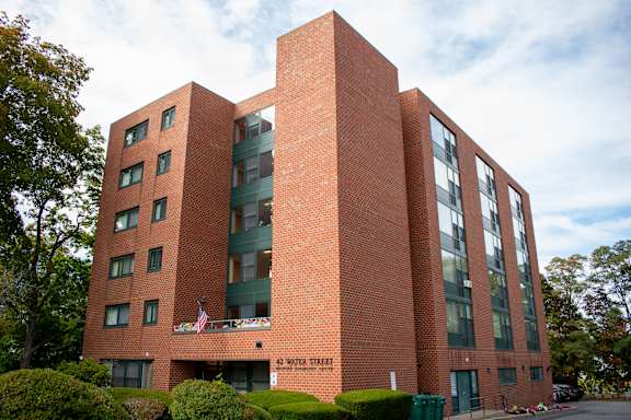 A red brick building with the words "6th Street" on the front.