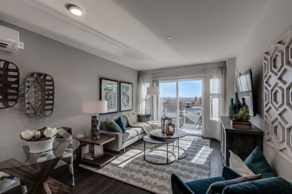 Lux Apartments Bellevue living room and sliding glass door to private outdoor balcony