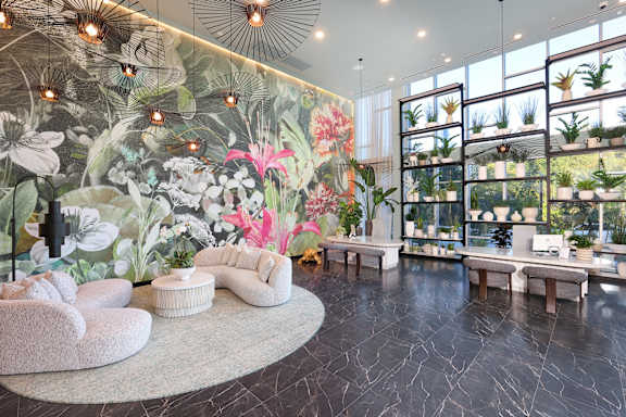 Park on First Apartments Lounge with Flowers and potted plants