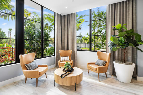 a living room with two chairs and a coffee table