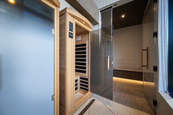 a sauna with a glass door