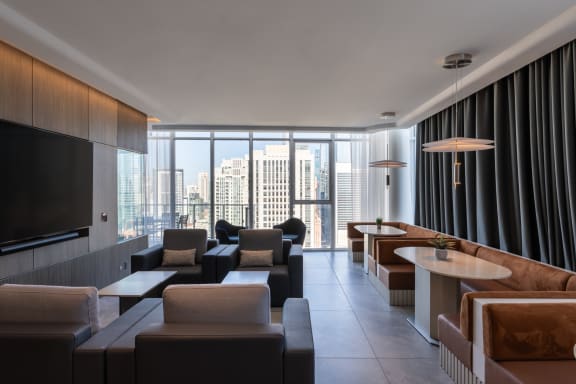 a living room filled with furniture and a large window