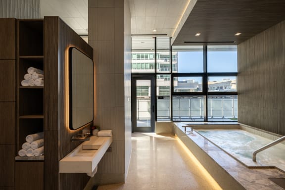 a bathroom with a large window and a bathtub