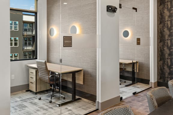 a conference room with a table and chairs and a window