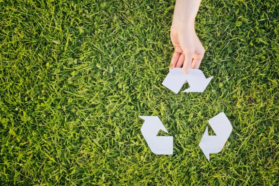recycling logo on grass-Vista Sunrise Apartments, Palm Springs, CA