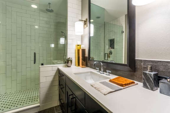 bathroom with white countertop at The Case Building in Dallas, TX