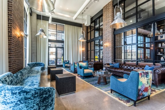 clubhouse with blue couches at The Case Building in Dallas, TX