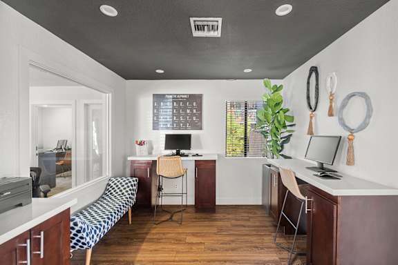 a home office with a desk and a chair