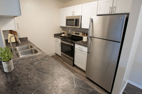 Kitchen at Apres Apartments in Aurora, CO