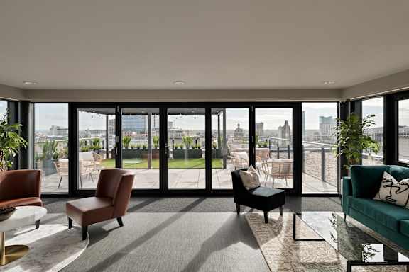 a living room with a view of the city