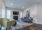 Thumbnail 6 of 11 - Living room at Quarry Apartments and Townhomes in DeWitt, Michigan