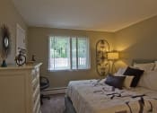 Thumbnail 4 of 17 - Furnished bedroom with lamp and window