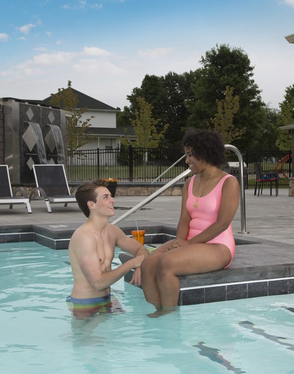 Residents at pool at Quarry Apartments and Townhomes in DeWitt, Michigan