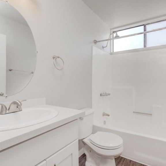 a bathroom with a sink toilet and a shower