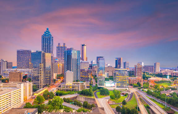 A cityscape with a highway running through it.