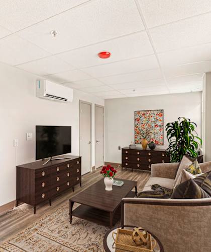 a living room with a couch and a tv