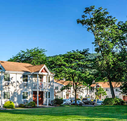 a row of houses on a lawn with trees at Pheasant Hill Estates, Harrisburg, Pennsylvania