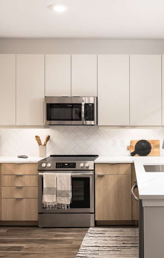 a rendering of a kitchen and living room in an apartment