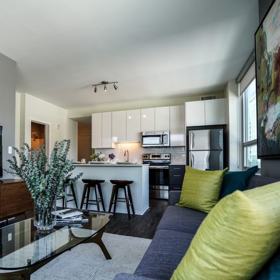 a living room with a couch and a coffee table  at Two Twelve Clayton, Clayton, MO