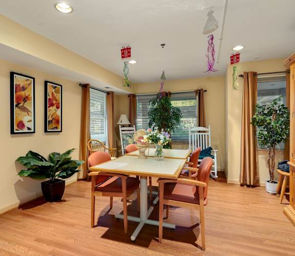 a dining room with a table and chairs