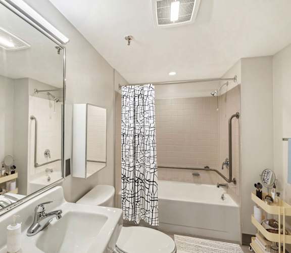 a bathroom with a sink and a tub and a toilet