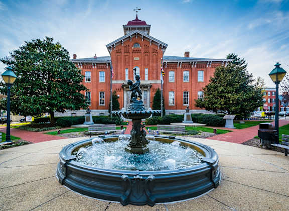 a fountain in front of a building campus