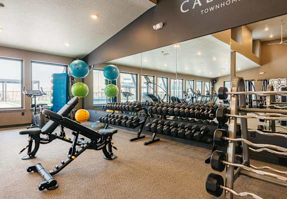 A gym with a sign that says "Cadwell Townhome".