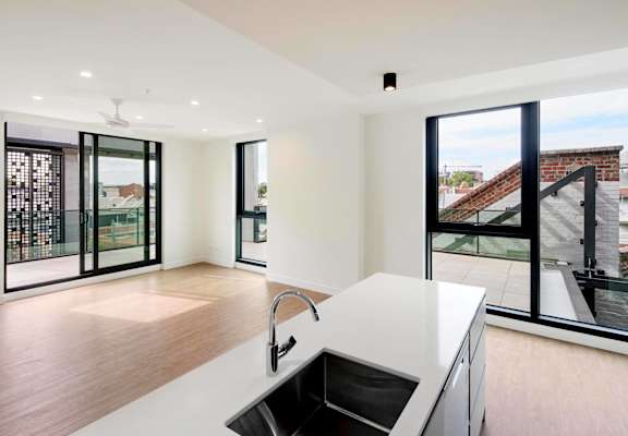 a kitchen with a sink and a large window