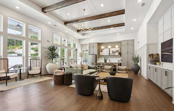 A spacious living room with a high ceiling and wooden floors. at Arcadia Cartersville Apartments, Georgia