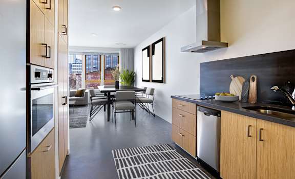Kitchen and dining area with a table and chairs and a large window