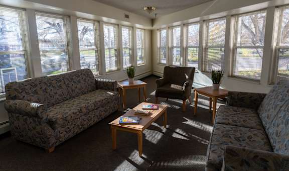 a living room with couches and chairs and a coffee table