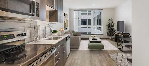 a kitchen and living room in a 555 waverly unit