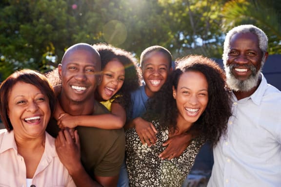 a group of people smiling and posing for a pictureat Millberry Apartments, St. Paul
