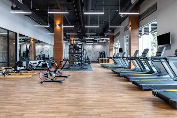 A gym with treadmills and exercise bikes. at Riverfront Everett, Everett, 98201