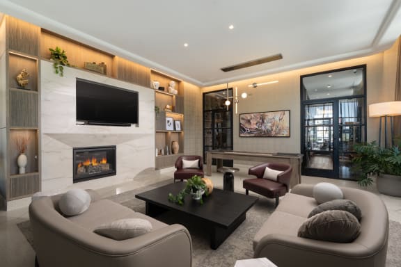 a living room filled with furniture and a large fireplace