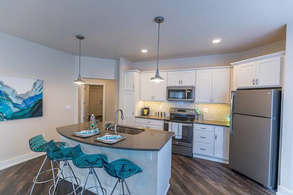 Spacious white kitchen at Quarry Apartments and Townhomes in DeWitt, Michigan