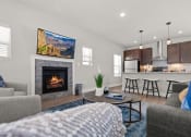 Thumbnail 1 of 11 - Living room at Quarry Apartments and Townhomes in DeWitt, Michigan