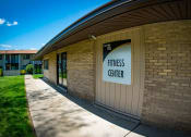 Thumbnail 18 of 26 - Carriage Park Apartments Fitness Center Signage