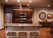 Thumbnail 37 of 53 - Eat-In Table With High Chairs In Clubhouse at The Brix Apartments, Spokane Valley, Washington