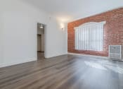 Thumbnail 3 of 14 - Living area with brick wall