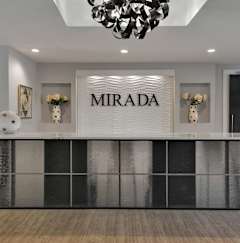 A reception desk with the word "MIRADA" on it.