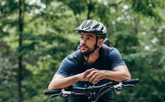 Man Riding a Bike with Foliage Behind Him at Country Woods, Ogden, UT