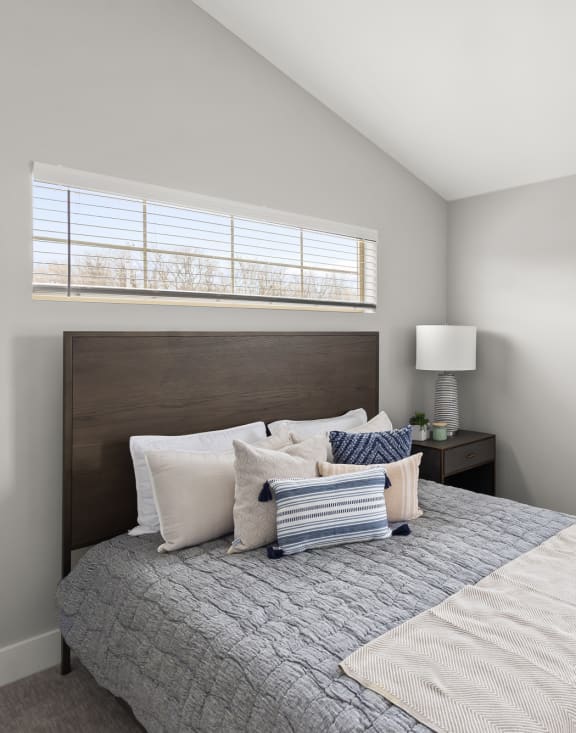 Bedroom at Quarry Apartments and Townhomes in DeWitt, Michigan