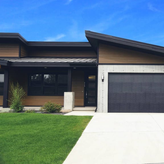 a house with a driveway and a garage door