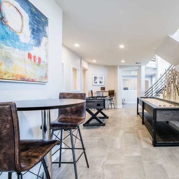 A room with a staircase and a painting on the wall. at Bridgwater, Greenwood Village, CO, 80111