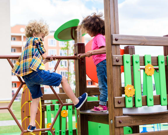 kids playing on the playground stock photo #