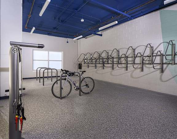 A bike is parked in a bike rack.